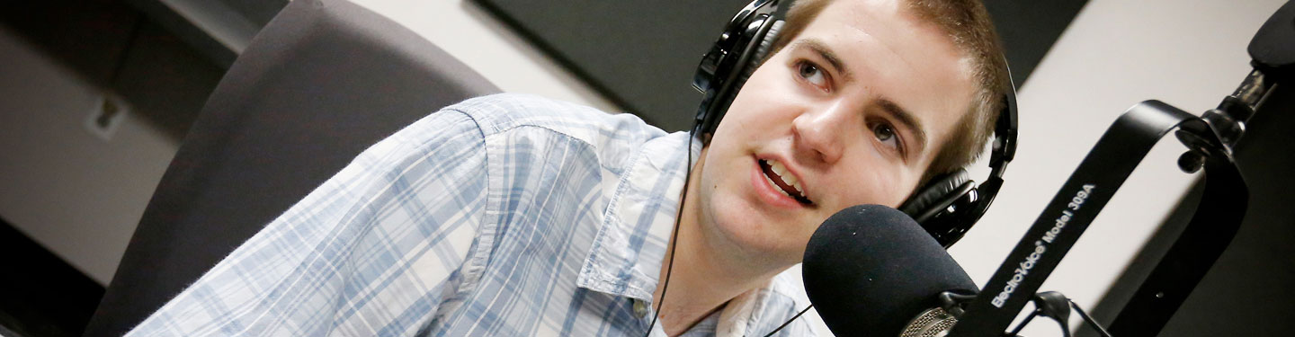 Student working at college radio station