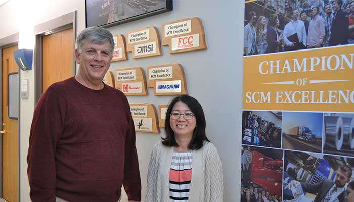Dr. Benson & Dr.Chau in front of SCM Center 