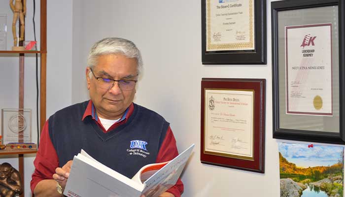 Dr.Seshadri working in his office
