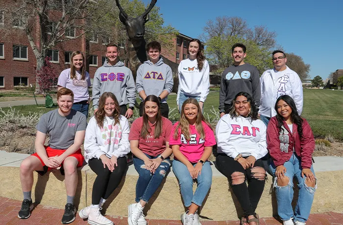 Fraternity and Sorority members posing for a photo