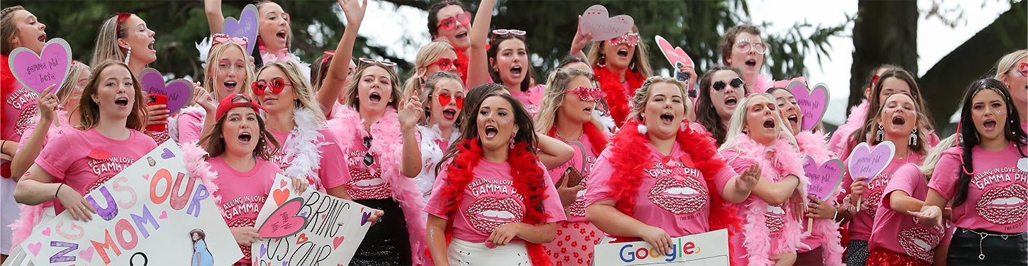 a sorority cheers during bid day