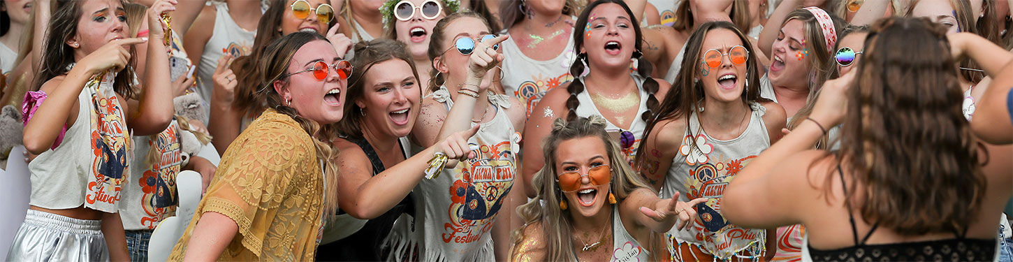 A sorority cheers during Bid Day