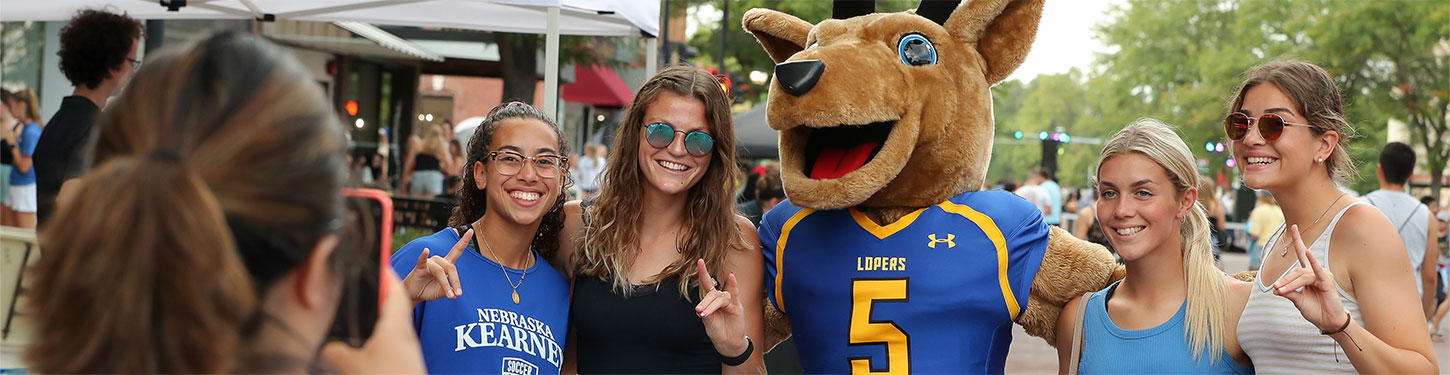 Students pose with Louie the Loper at the Destination Downtown event