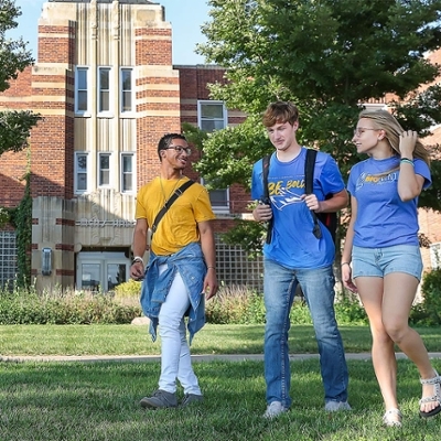 Group of UNK students walking in front of Men's Hall