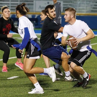 Students playing flag football