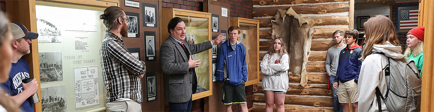 students and instructors learning at a museum