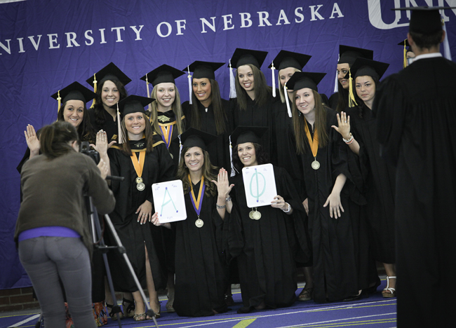 Students getting photo taken at commencement