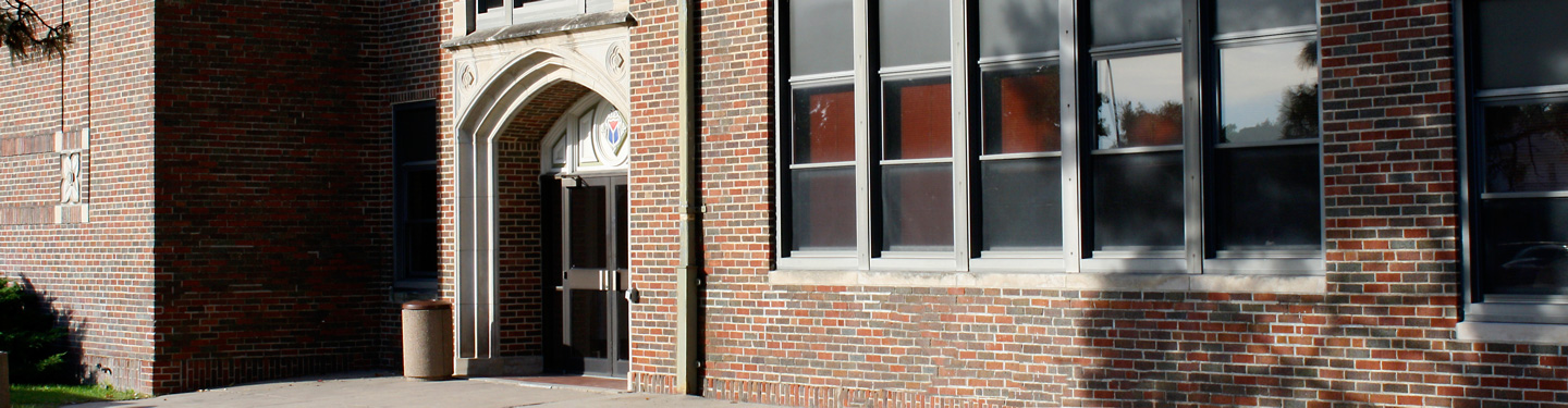 Student in front of Thomas Hall