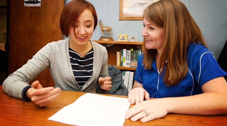 student working with faculty