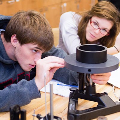 students work on a project in a physics lab