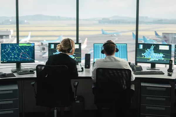 workers in an air traffic control room
