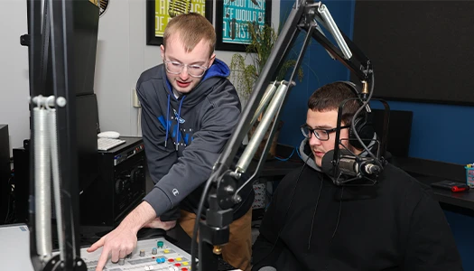 students work in a radio booth
