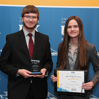 Student Holding Award