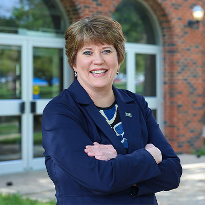 Brook envick, Dean of UNK's College of Business and Technology standing outside west center