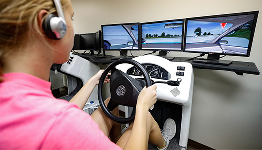 Student using the driving simulator at the Safety Center