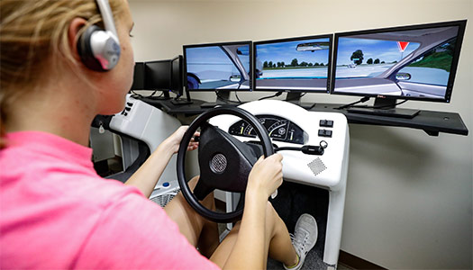 Student using the driving simulator at the Safety Center