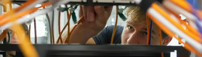 a student works on a server rack