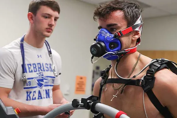 a student does fitness testing on another student