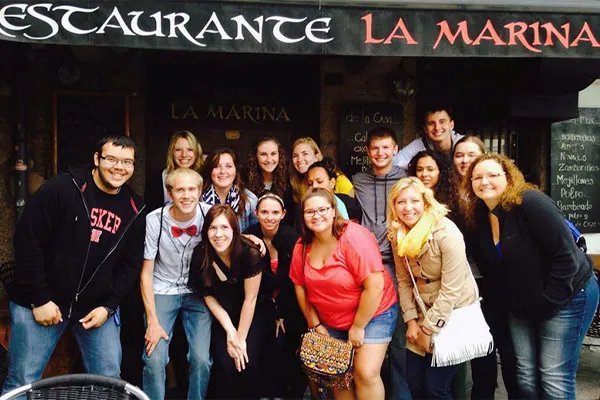 a group poses for a photo during a trip to france