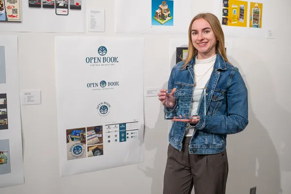 a student presents her award winning graphic design and branding work