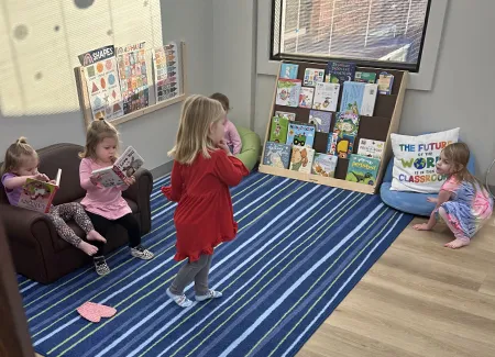 children read books in the learning center