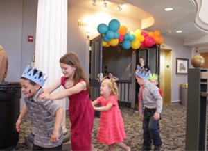 children dance at an event