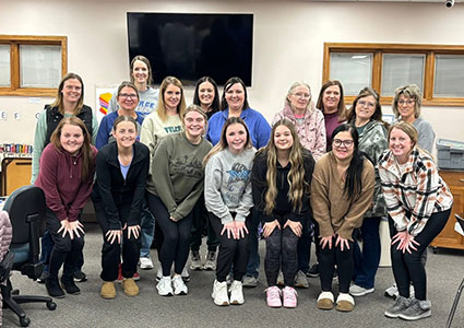 childcare workers in pierce pose for a photo
