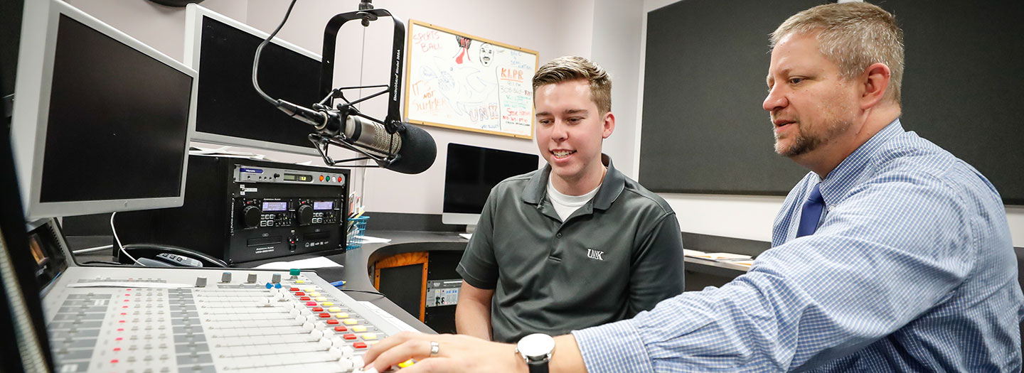 UNK Student working with Professor in the campus radio station