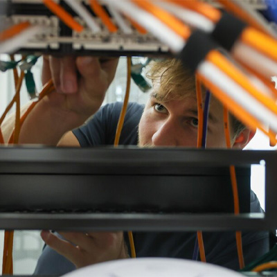 close up of a student working on a server