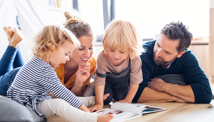 a family reads with their children