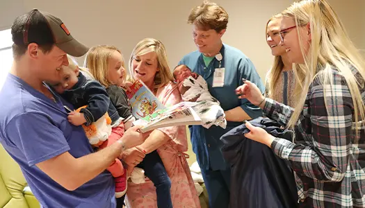 family welcoming new baby
