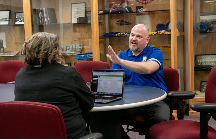 a teacher talks with a student