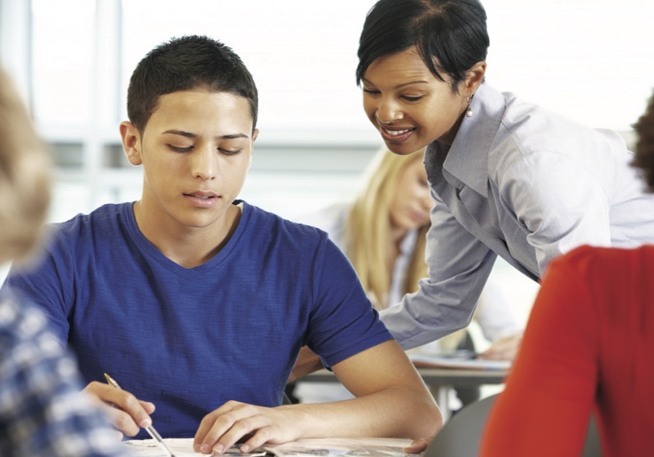 Teacher helping student