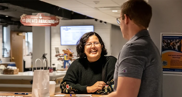 student chat during a social event