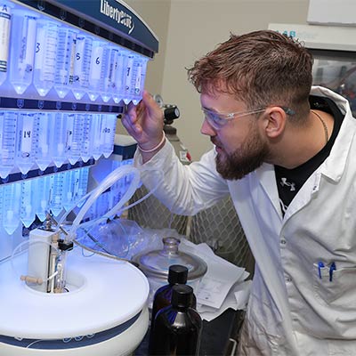 a students works with medical equipment