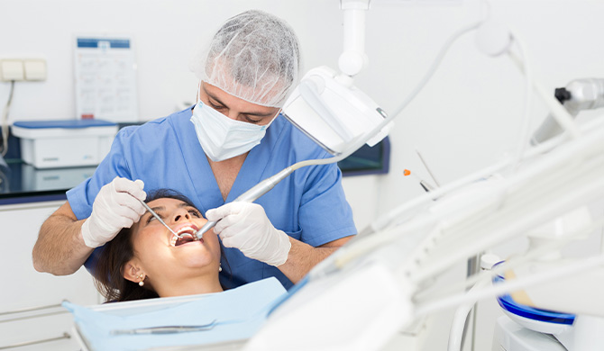 Dentist performing procedure