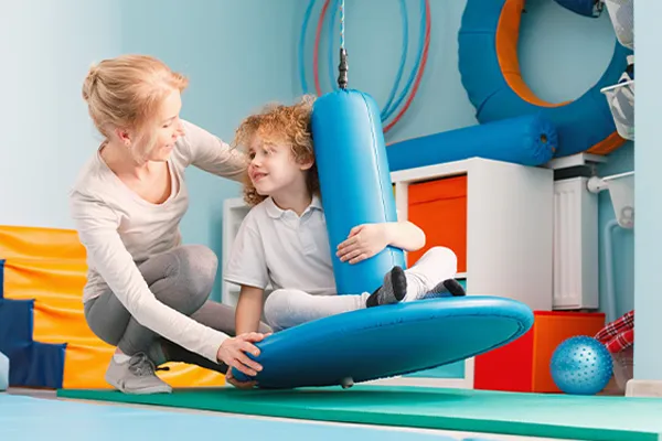 an Occupational therapist works with a student