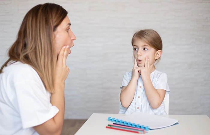 a Speech Language Pathologist works with a child