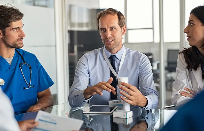 A man addresses a room of doctors