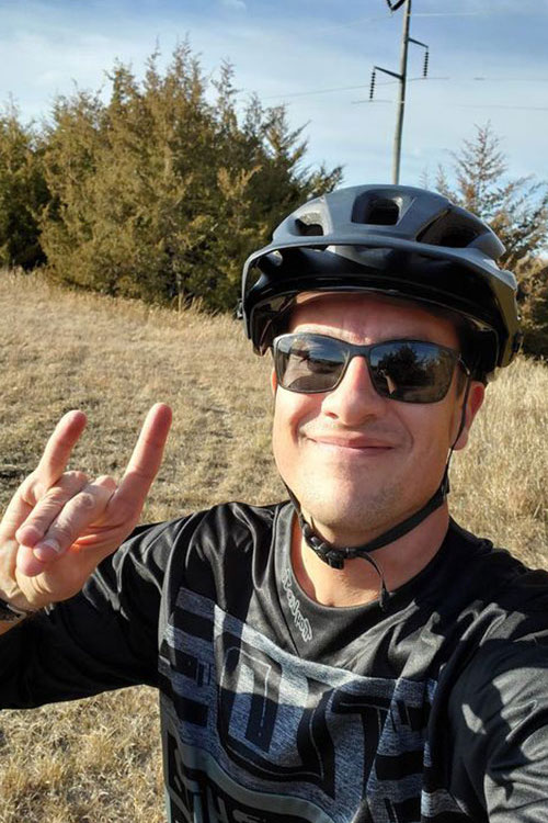 Dr. David Vail "throws the lopes" on a bike ride