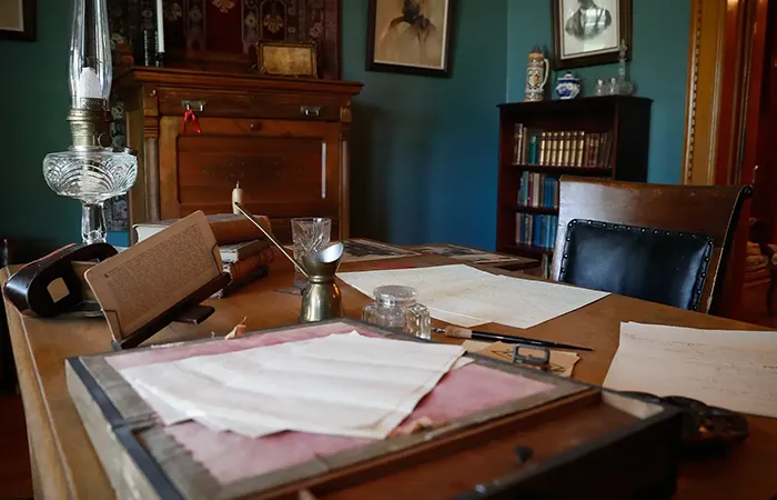 photo of a desk in the frank house museum