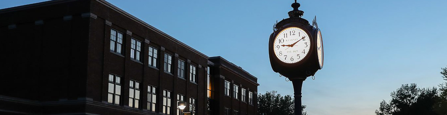 a photo of a clock on UNK's campus