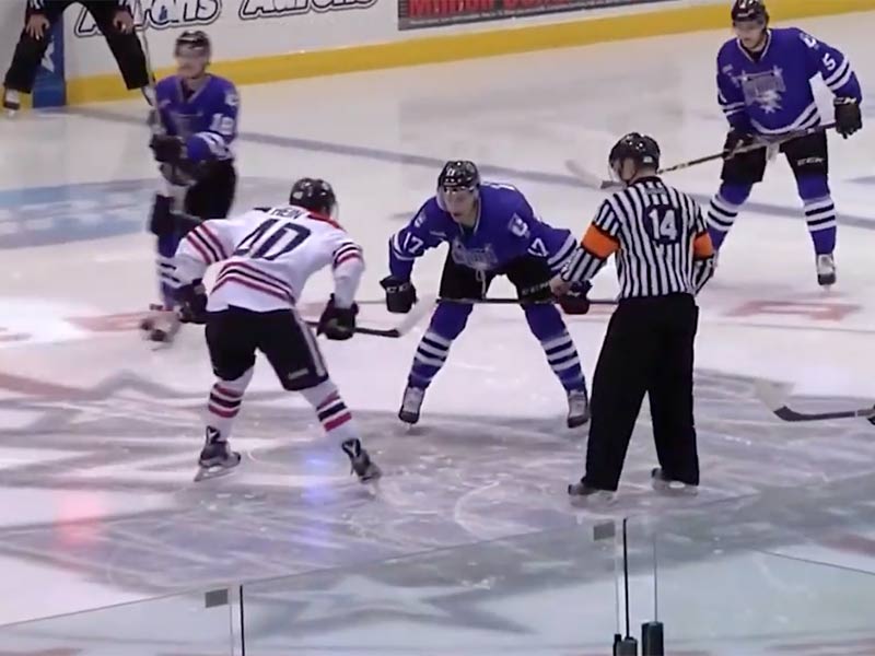 Storm Hockey players getting reading for the puck to drop