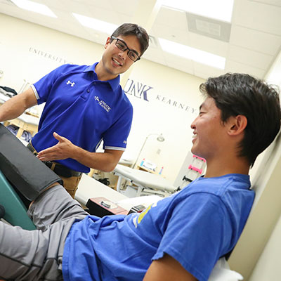 A students practices patient care in the athletic training lab