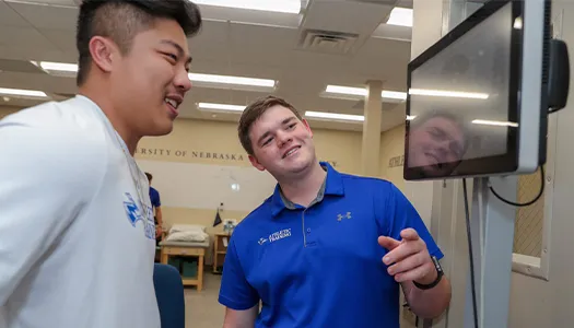 a student works with a patient at a clinic