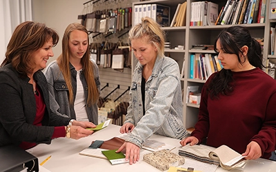 students working on a project with an instructor