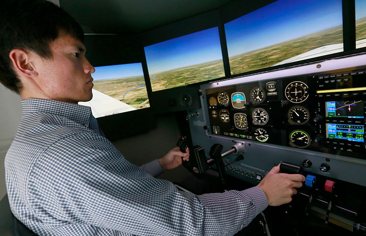 University of Nebraska at Kearney Student in flight simulator
