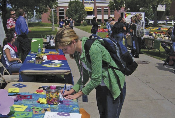 Woman working at a math booth