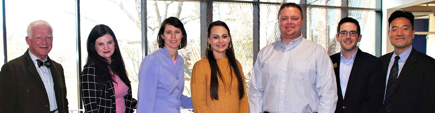 faculty and students at an MBA event in discovery hall