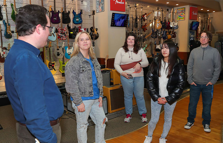 students tour a music store